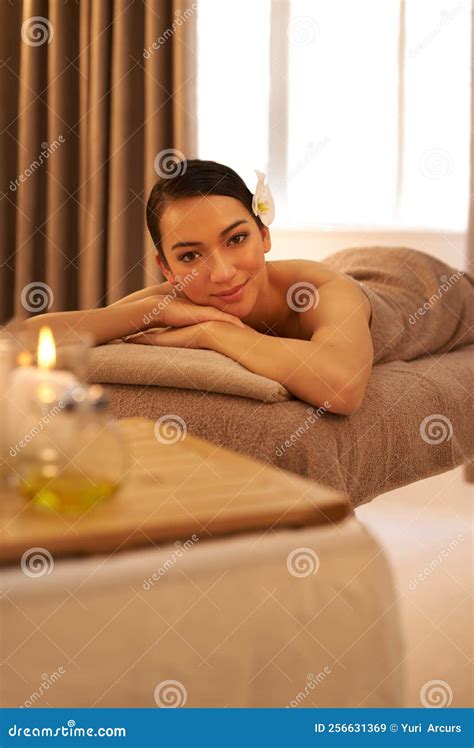 A Day To Recharge And Repair A Beautiful Young Woman Relaxing On A Massage Table Before Her