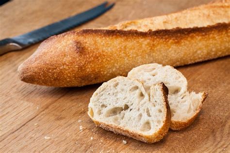 A small loaf of crusty bread rests nearby. How to Heat Up a Loaf of French Bread | LEAFtv