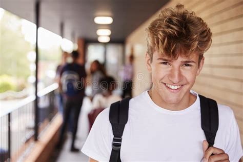 Portrait Of Male Teenage Student On College With Friends Stock Photo