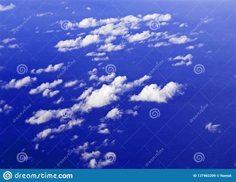 Lilac Sky With Cumulus Clouds From An Airplane Window Stock Image