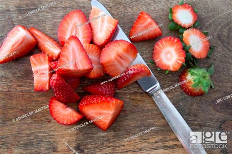 Strawberries Cut Into Small Pieces Stock Photo Picture And Royalty
