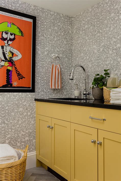 Downloadable laundry room decor, laundry co. Multicolored Laundry Room With Orange Art | HGTV