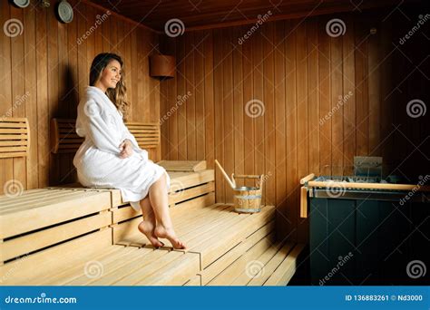 Beautiful Woman In Sauna Pouring Oils On Hot Stones Stock Image Image
