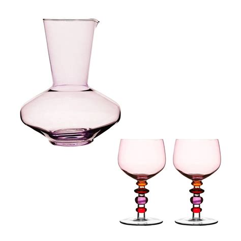 Dress Up Your Dinner Table With This Stylish Pink Carafe And Glassware