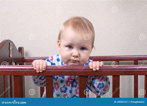 Sad Baby Girl Standing In A Crib Stock Image Image Of Stand Baby