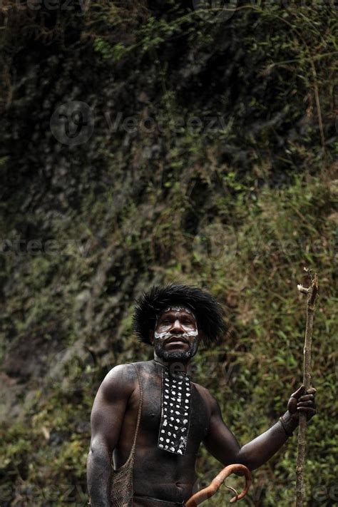 Portrait Of Dani Tribe Man Wearing Koteka Traditional Clothes Of Papua Dani Tribe Men Looking
