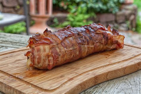 Place pork loin on a cookie sheet lined with aluminum foil. Juicy pork tenderloin wrapped in bacon with apples from ...