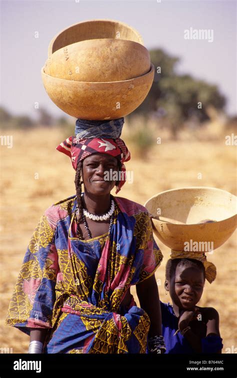 Delaquara Niger West Africa Fulani Woman Balancing Empty Calabashes