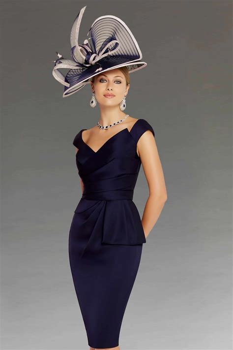 A Knee Length Dress That Features A Wrap Effect Bodice It Has An
