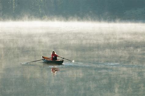 A Woman Rowing A Scull Boat A Foggy Photograph By Kennan Harvey Fine Art America