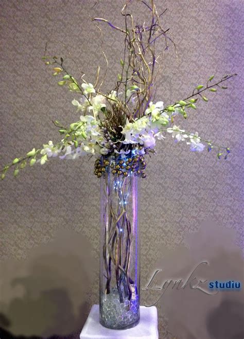 Tall Centerpiece From Dendrobium Orchids And Golden Curly Willow Branches Tall Centerpieces