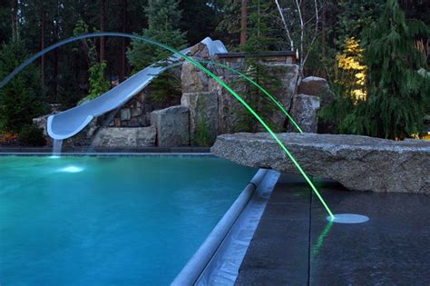 Led Lit Laminar Jets Adorn This Pool Surrounded By Beautiful Stonework