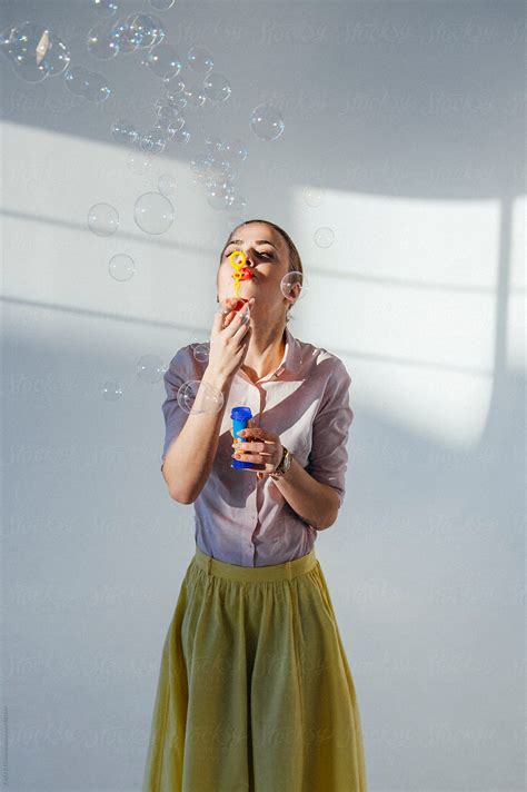Girl Blowing Bubbles By Stocksy Contributor Danil Nevsky Stocksy