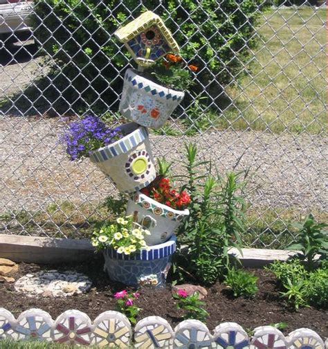 15 Cool Diy Flower Tower Ideas Flower Tower Garden Whimsy Planter Pots