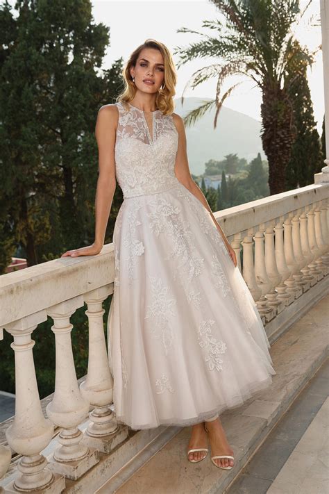 Ruches on the skirt create volume. Wedding Dresses For The Mature Bride - Modern Wedding