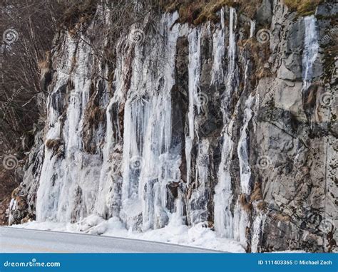 Frozen Waterfall Plunging From A Steep Rock Cliff Stock Image Image