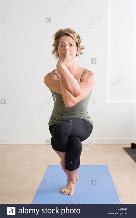 Woman Yoga Pose Crossed Legs Stock Photos And Woman Yoga Pose Crossed