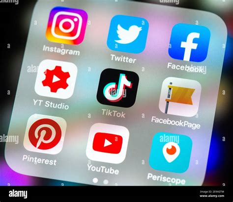 Social Media App Icons In Folder On Iphone Screen Stock Photo Alamy