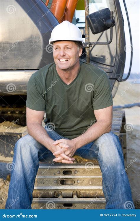 Smiling Construction Worker Is Standing With Shovel Front View Studio