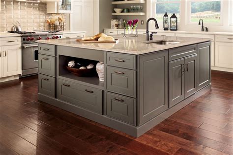 A kitchen is a source of togetherness in a home, acting as a hub for the home environment. Kraftmaid Midnight Suede Kitchen Island With Dove Cabinets ...