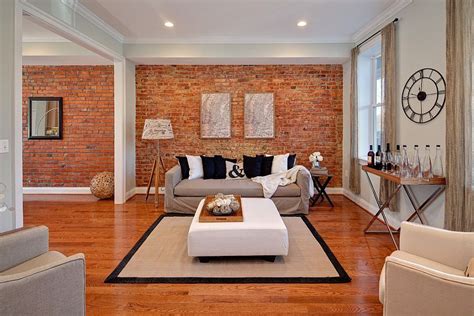 A dark gray wall paint can make an attractive design when paired with an exposed brick wall. 100 Brick Wall Living Rooms That Inspire Your Design ...