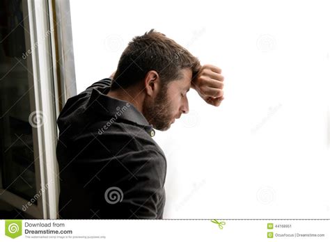 Attractive Man Leaning On Window Suffering Emotional Crisis And