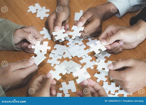 Hands Of Diverse People Assembling Jigsaw Puzzle Team Put Pieces