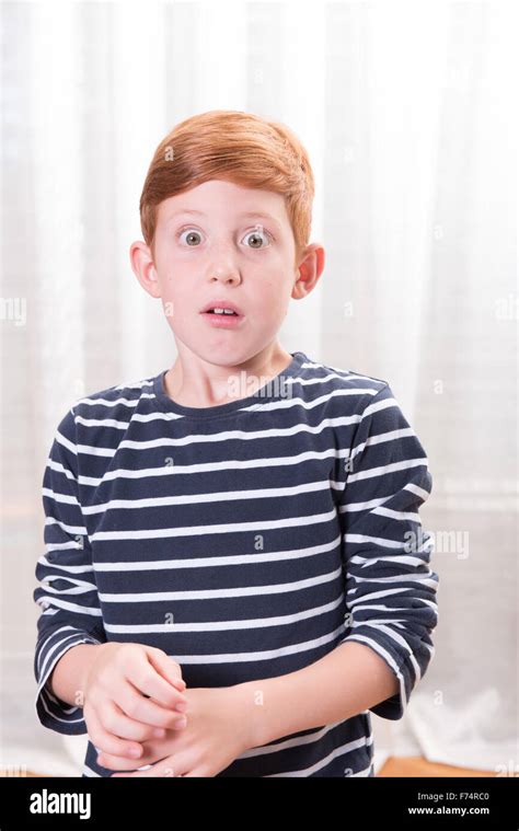 Portrait Small Boy Scared With Eyes Wide Open Stock Photo Alamy
