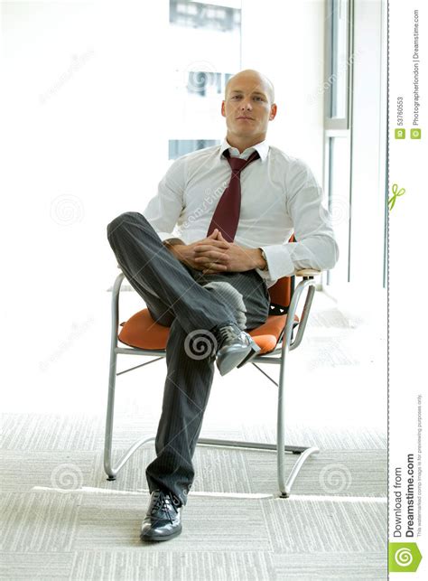 Young Confident Caucasian Businessman Sitting On Office Chair Stock