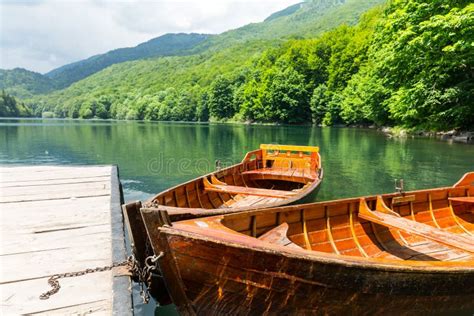 Wooden Boats At Pier On Mountain Lake Stock Photo Image Of Peaceful