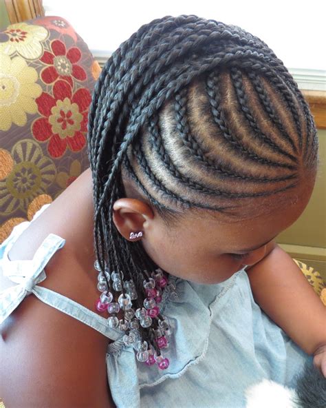 What about braiding your girl's hair into dozens of thin cornrows, and wrapping them into a bun? Curves Curls & Style: Natural Hair: Summer Styles for Kids