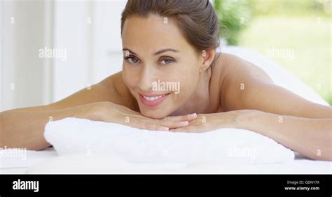 Woman Smiles And Relaxes On Massage Table Stock Photo Alamy