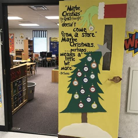 a classroom door decorated for christmas with decorations and writing on the front along with