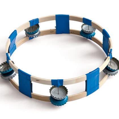 Classically the term tambourine denotes an instrument with a drumhead, though some variants may not have a head. Bottle Cap Tambourine | Fun Family Crafts