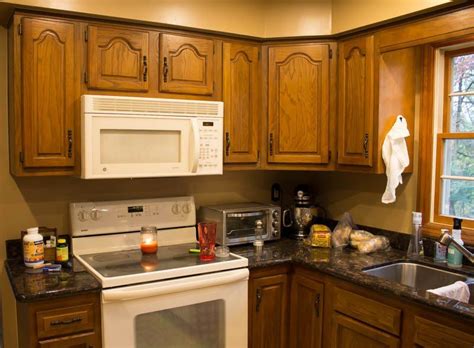 Using the wooster shortcut paint brush, paint any areas of the cabinet. How to Paint Oak Cabinets WHITE | Painting kitchen ...