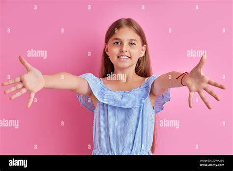 Kind Caucasian Affable Girl Spreading Her Arms Want To Hug Everyone