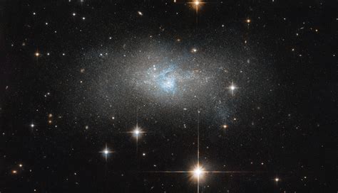 Hubble Images A Galaxy With Threads Of Blue Nasa