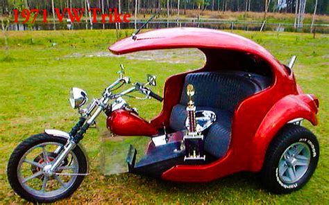 A Red Motorcycle With A Side Car Attached To The Back Is Parked On Some