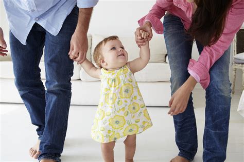 Parents Teaching Baby Girl To Walk Childrens Support