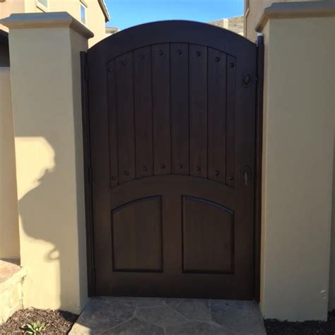 Custom Wood Gate With Arched Crossbar And Raised Panels By Garden