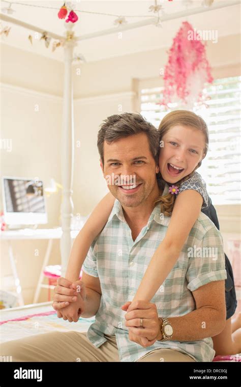 Father And Daughter Hugging On Bed Stock Photo Alamy