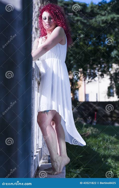 Woman With White Dress Leaning Against A Wall Stock Photo Image Of Looking Girl