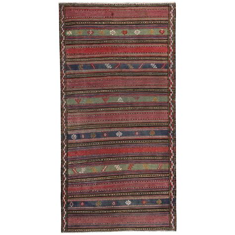 Modern Turkish Kilim Rug With Green And Navy Geometric Details On Red