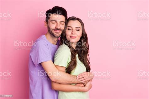 Portrait Of Attractive Dreamy Cheerful Couple Embracing Amour