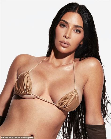 Kim Kardashian Slips Into A Skimpy Gold Bikini