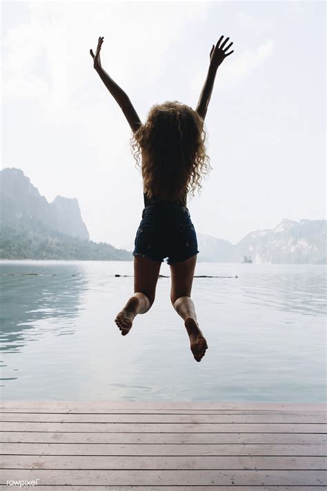 Happy Woman Jumping With Joy Premium Image By Mckinsey