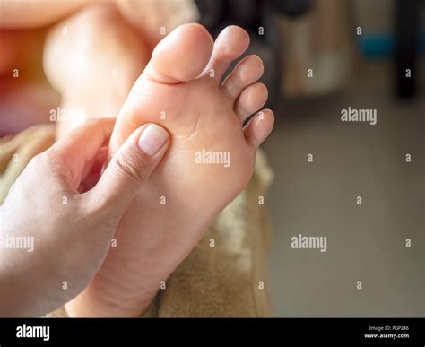 Close Up Massage Therapist Using Thumb To Woman Foot With Oil Traditional Original Thai Massage