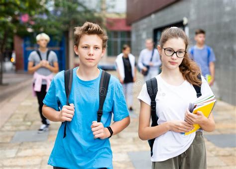 Two Teenage Students Going To College On Autumn Day Stock Image Image