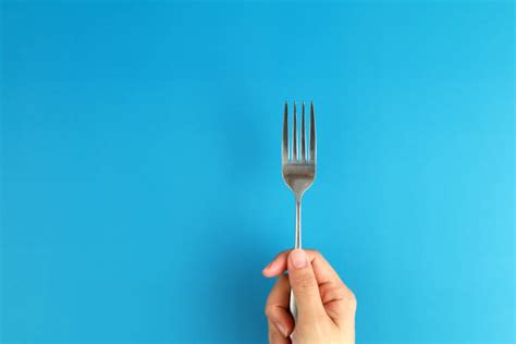 Hand Holding Fork Stock Photos Pictures And Royalty Free Images Istock
