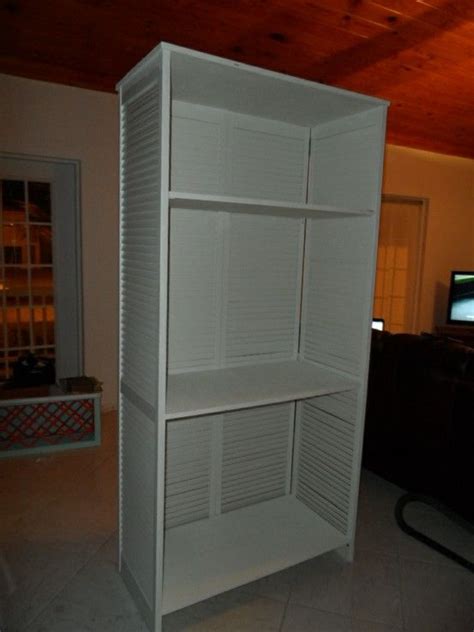 I used plywood the beginning i… Shelf unit made from a pair of old bi-fold doors and scrap ...